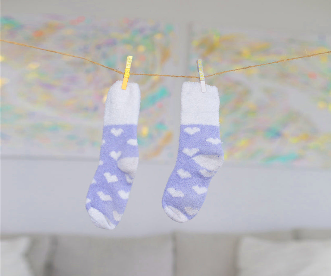 Travel socks hanging on travel clothesline flexoline