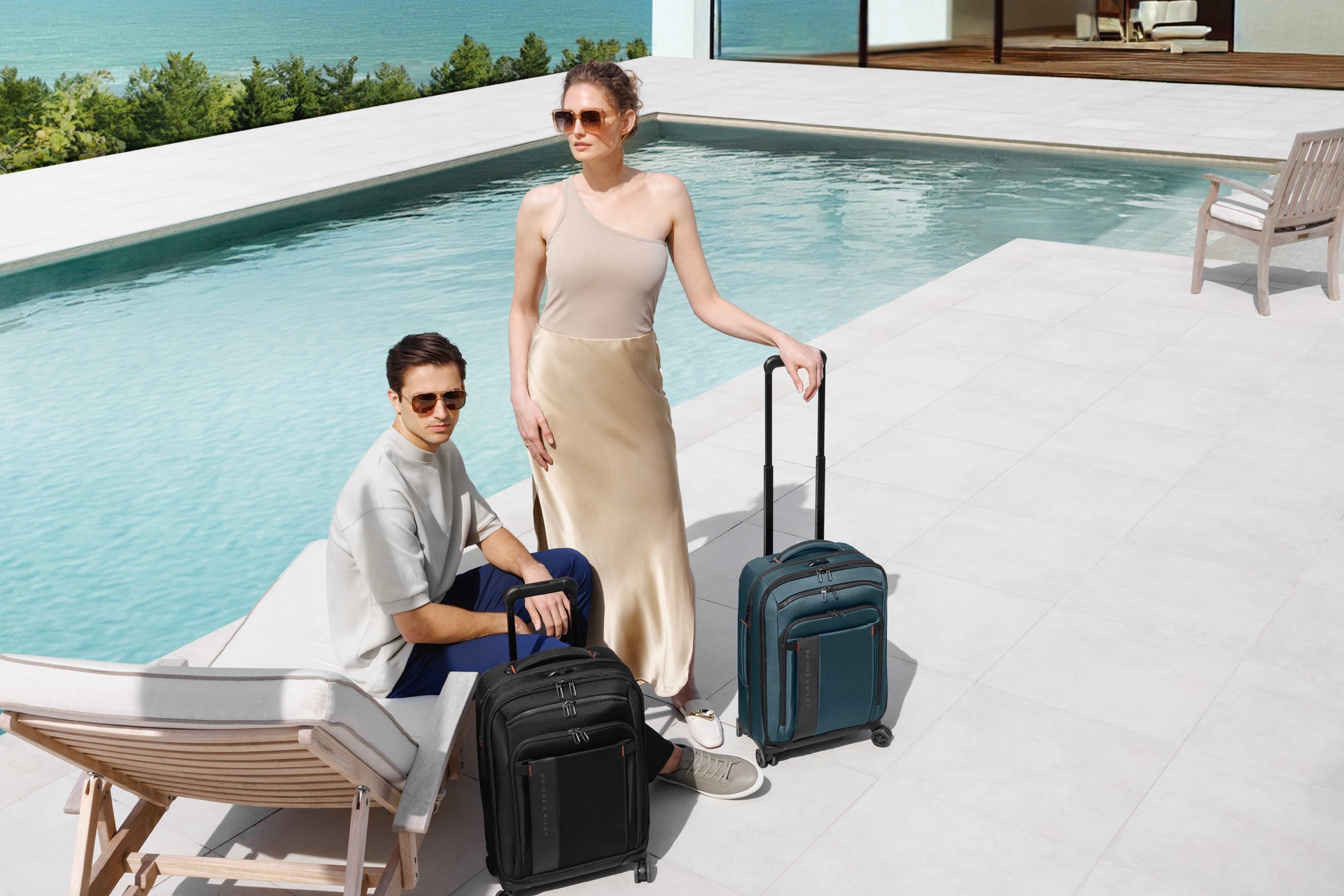 woman and man by pool with luggage