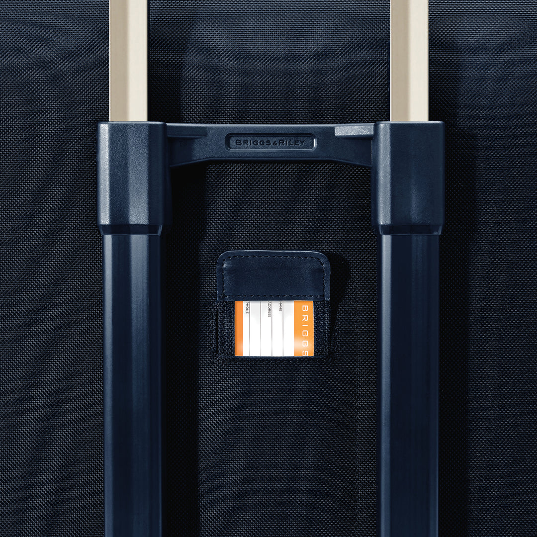 Close up of Hidden ID tag in Navy Blue color Briggs & Riley Baseline Deluxe Wardrobe Spinner