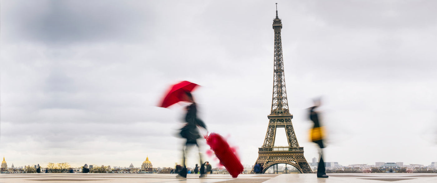 Woman in Paris in Mycra Pac Raincoat and Umbrella