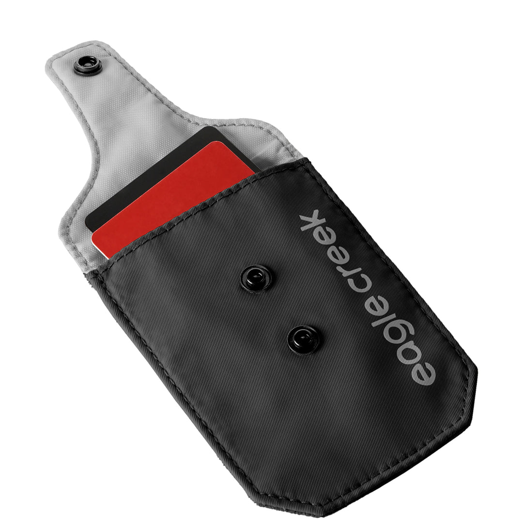 Eagle Creek Undercover RFID Bra Pouch in color black with grey lining holding two credit cards
