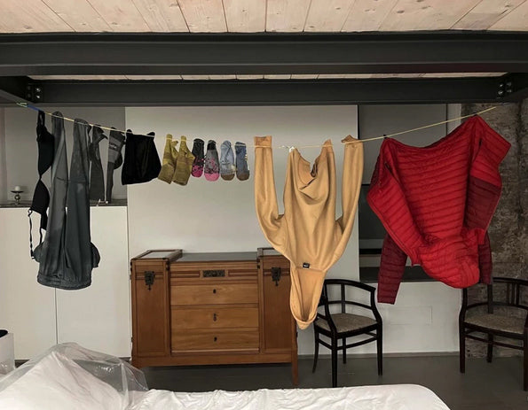 Customer image using the Going In Style Travel Clothesline to try socks, shirts and pants