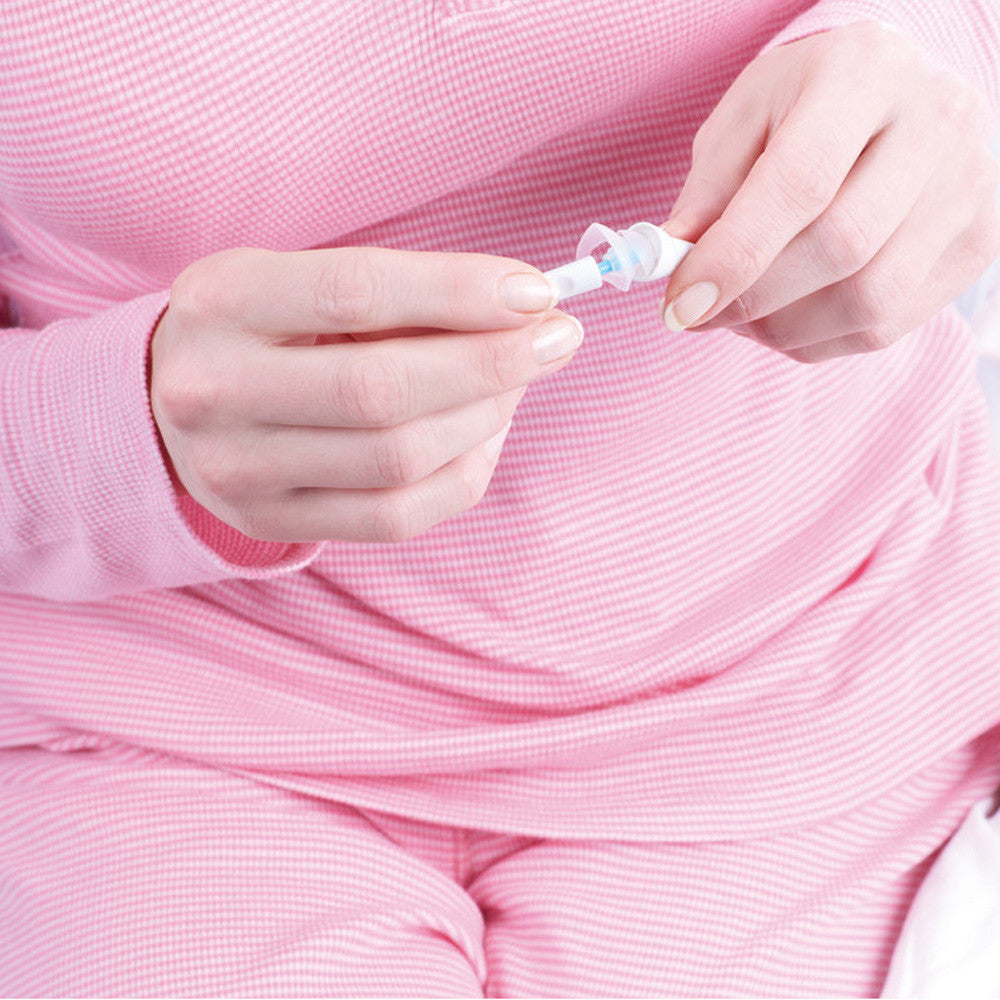 Woman Using Z Zone Ear Plugs Size Adjusters