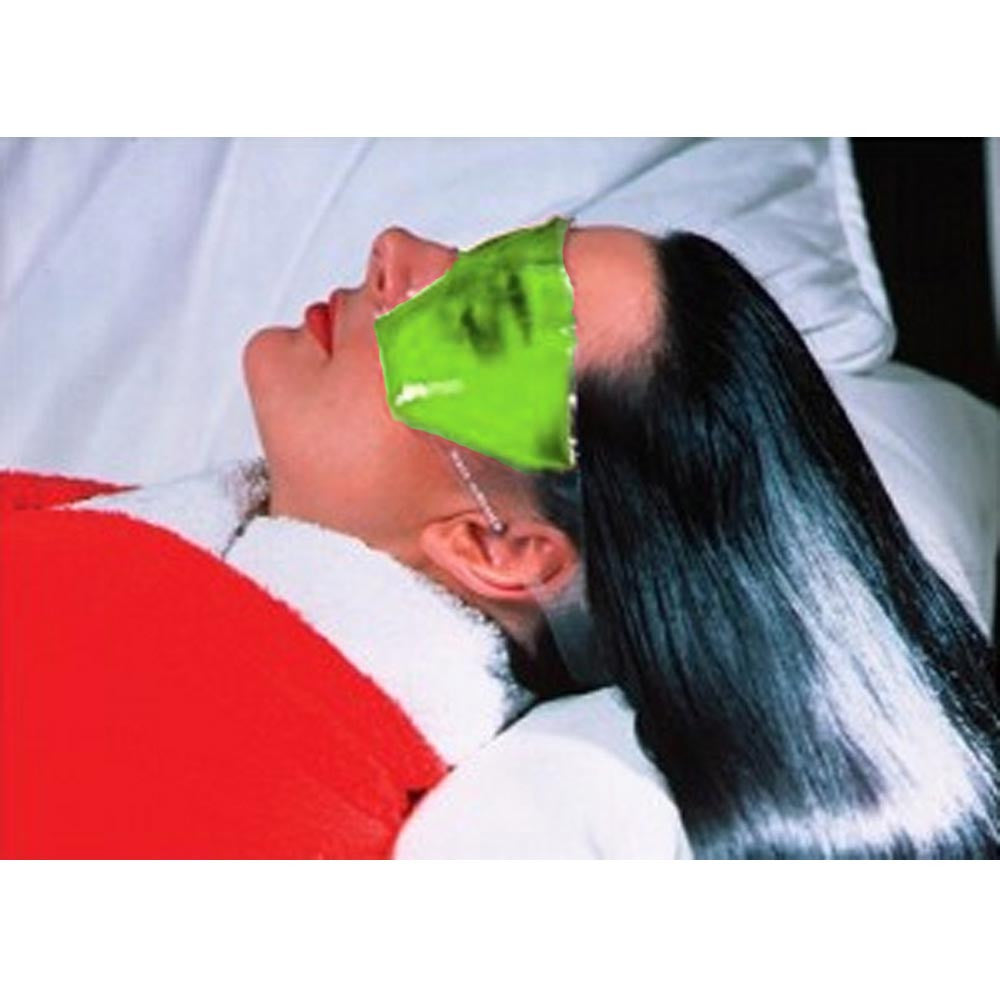 Green Gel Eye Mask Worn By Woman Relaxing in Bathrobe in Bed