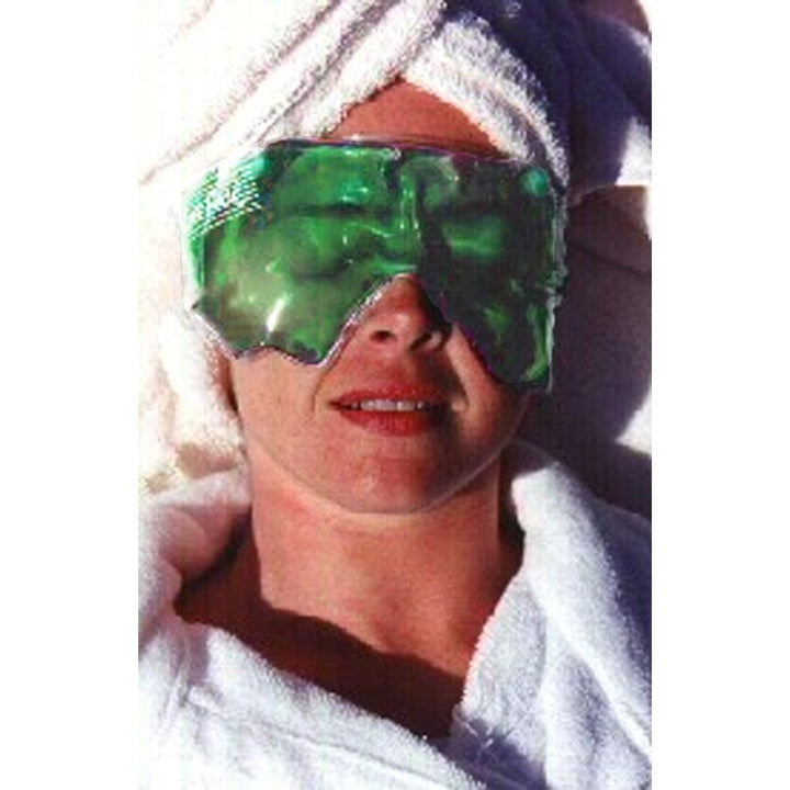 Woman Wearing Green Eye Mask with White Bathrobe and Towel on Head