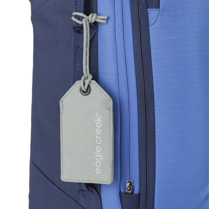 Grey color Eagle Creek Reflective Luggage Tag hanging from suitcase