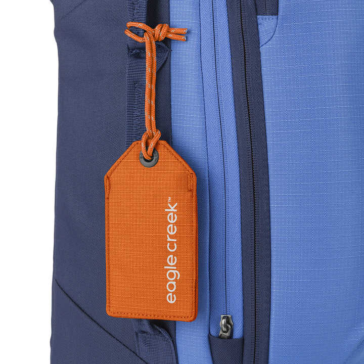 Bright Orange color Eagle Creek Reflective Luggage Tag on blue suitcase