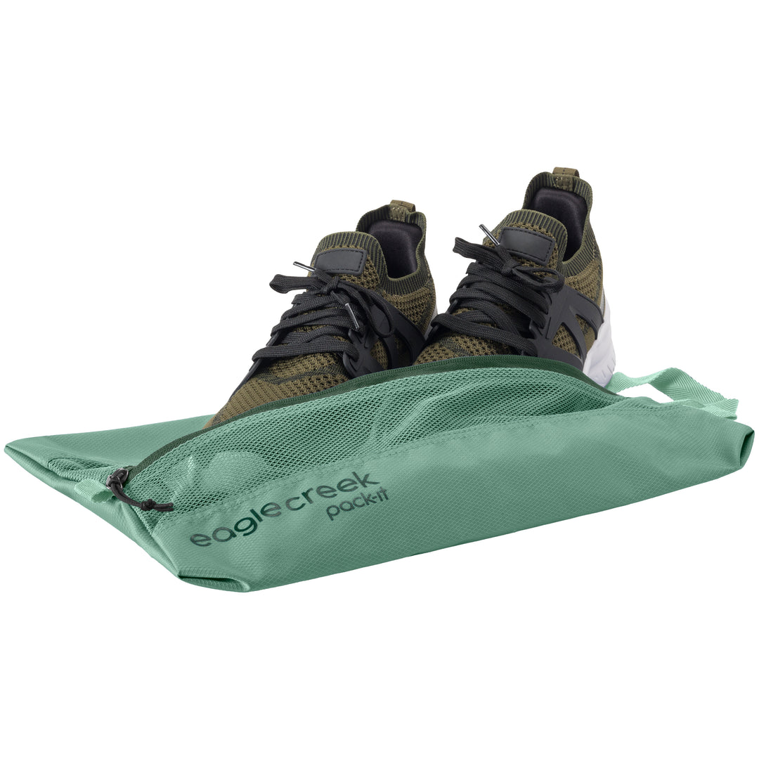Eagle Creek Pack-It® Reveal Shoe Sack Willow Green with green running shoes packed inside