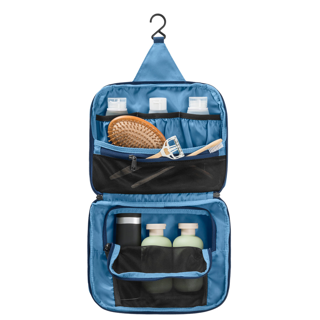 Light blue Eagle Creek Pack-It® Hanging Toiletry Kit open packed with shampoo conditioner brush and razor