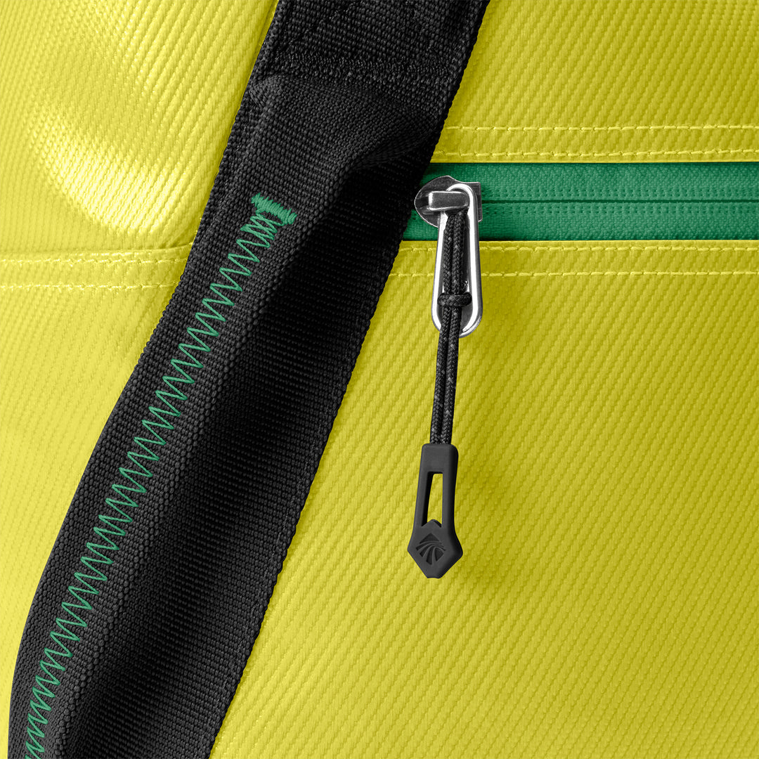 Close up of zipper pull Eagle Creek Migrate Tote Bag color electric yellow