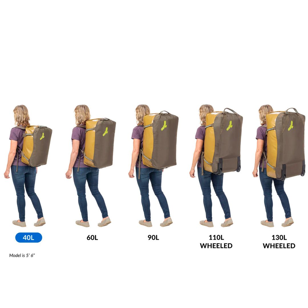 Woman wears Eagle Creek Migrate 40L Duffel Bag as backpack in various sizes 