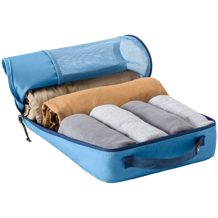 Blue Compression packing cube packed with pants and shirts as part of set