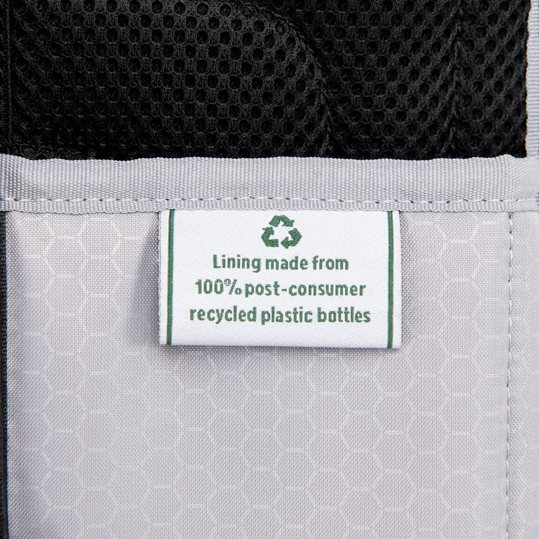 Up close material tag of Travelpro Maxlite 5 Carry-On Rolling Underseat Bag Lining made from 100% recycled bottles
