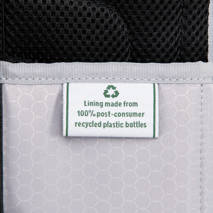 Up close material tag of Travelpro Maxlite 5 Carry-On Rolling Underseat Bag Lining made from 100% recycled bottles